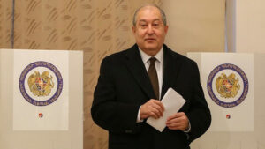 Armenian President Armen Sarkissian votes during an early parliamentary election in Yerevan